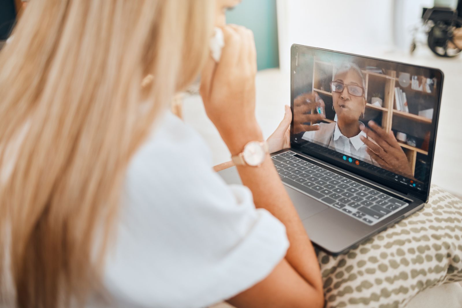 Image of woman watching an educational session on a laptop