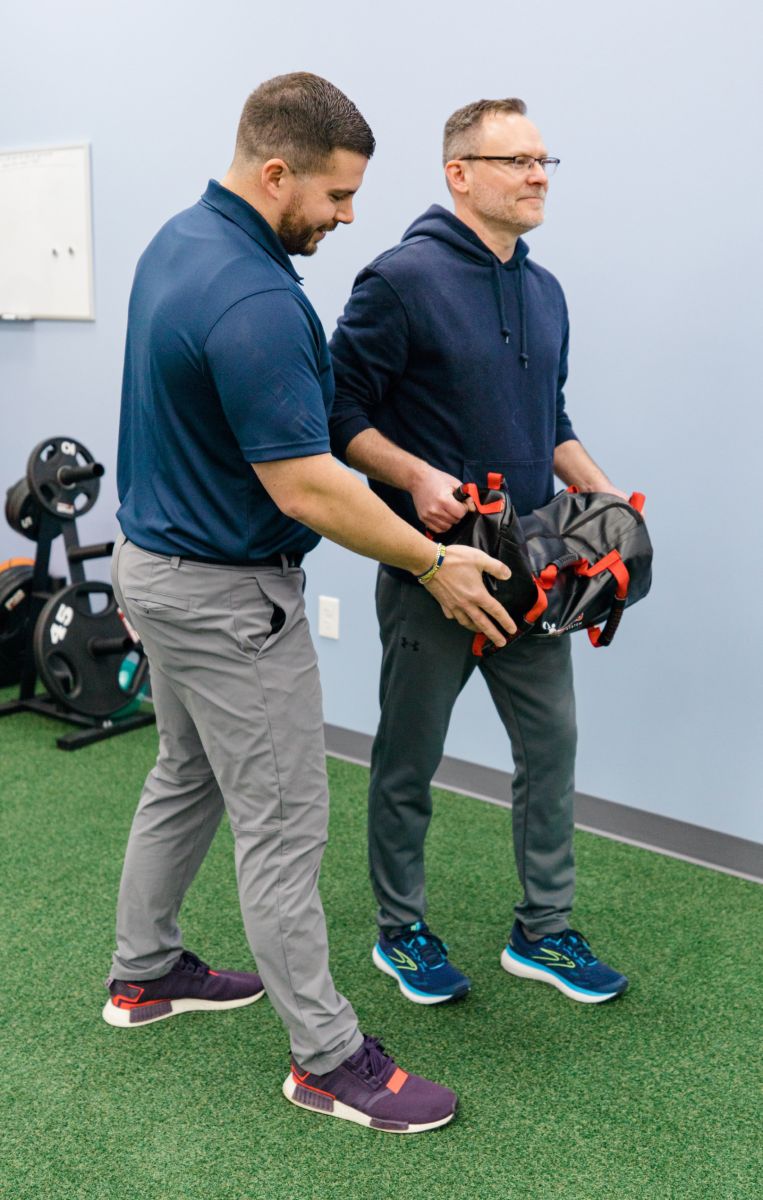 Image of person working with a physical therapist